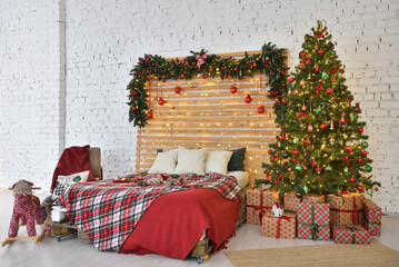 Obraz premium Christmas bedroom interior on a brick wall background