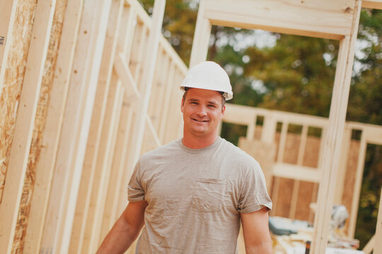 Caucasian construction worker smiling on site
