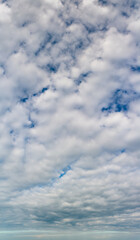 Fantastic clouds against blue sky, panorama