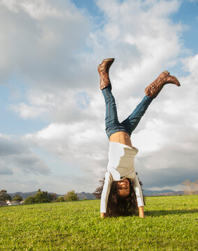 Mixed race girl doing cartwheel