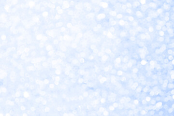 Abstract blue and white bright shiny light bokeh background.  Snowfall, snowflake, winter season, New Year, Christmas and all celebrations background concept. 