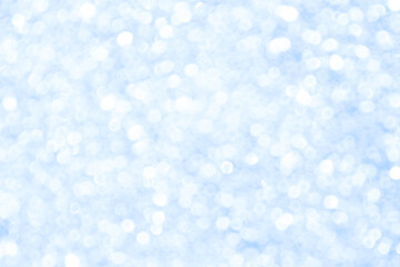 Abstract blue and white bright shiny light bokeh background.  Snowfall, snowflake, winter season, New Year, Christmas and all celebrations background concept. 