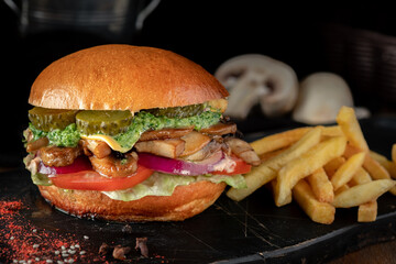 Vegetarian Burger with mushrooms, fresh vegetables and guacamole sauce
