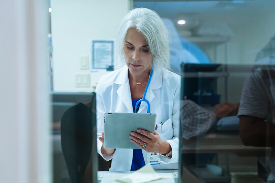 Doctor using digital tablet
