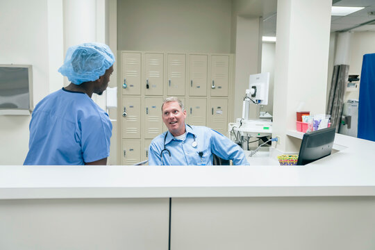 Doctor and nurse talking in hospital