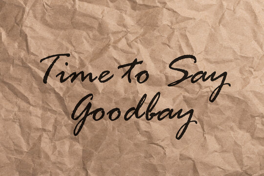 Text TIME TO SAY GOODBAY on craft crumpled paper
