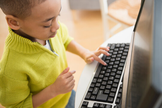 African American boy using computer