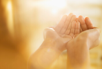 Mixed race woman holding out cupped hands