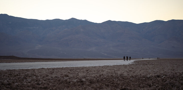 people walking on salt bed