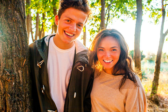Caucasian couple smiling in park