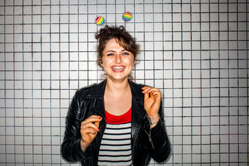 Caucasian woman wearing colorful antenna near wall