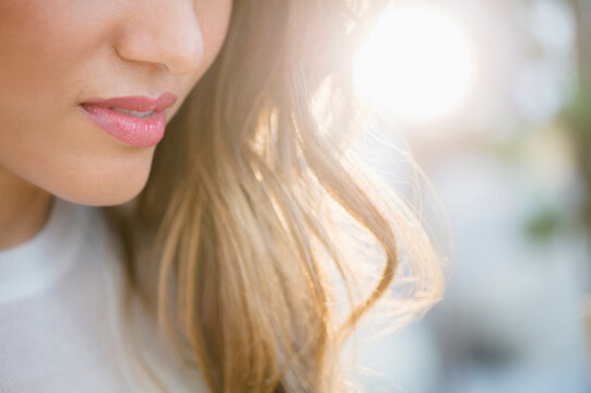 Close up of lips and hair of Hispanic woman