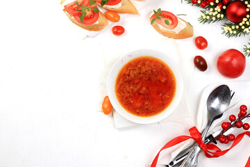 Traditional Russian borscht with parsley and bread on the festive table, business card for the menu, natural products and ingredients, healthy food concept, rustic style, selective approach.
