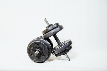 Weights on a white background. The concept of sports, exercises in the gym.