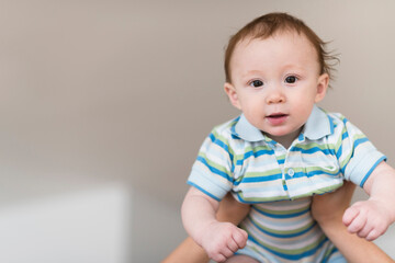 Father lifting Caucasian baby