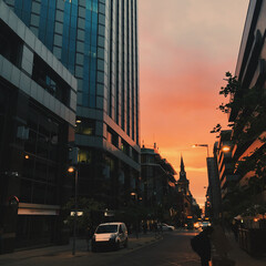 Traffic and buildings at sunset in the city downtown