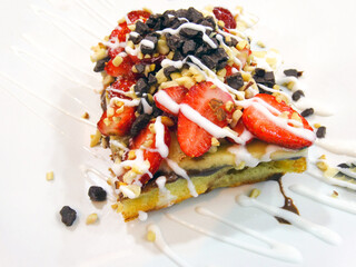 Strawberry waffle with chocolate.Sweet dessert Chocolate waffle concept