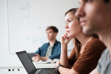 Student listening in college classroom
