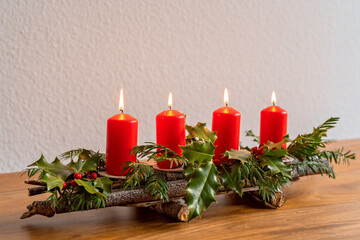 Handmade advent candles stick holder made from natural eco materials. DIY, sustainable Christmas, zero waste, plastic free, eco friendly gift and home decor. Lighting fourth candle of Advent