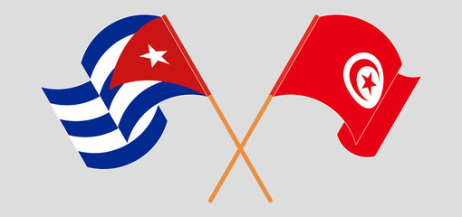 Crossed and waving flags of Cuba and Tunisia