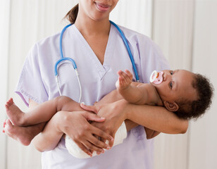 African nurse holding baby