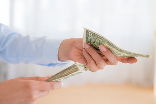 Hispanic woman counting money
