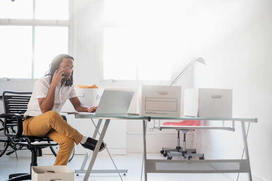 Black businessman working in new office