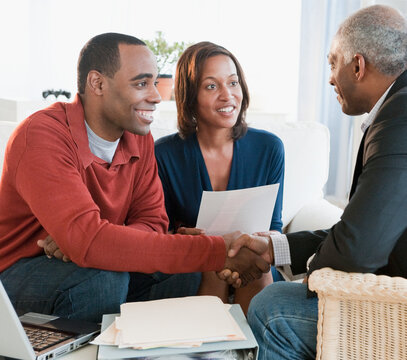 African American couple talking with financial advisor