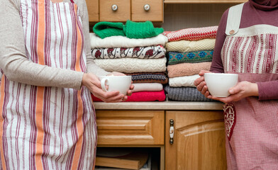 Couple woman pullover a lot holding coffee tea cup red festive new year