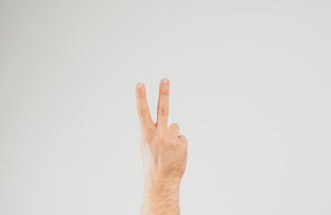 Hand raised up. Concept of giving hand signs, reporting, wanting help. Hands in the air.
