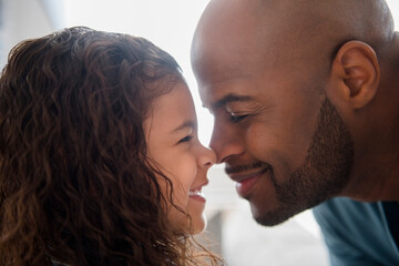 Father and daughter rubbing noses