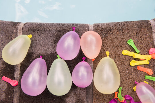 Water balloons at the edge of swimming pool