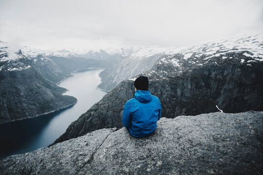 Caucasian man admiring scenic view of mountain river