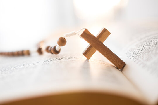 Rosary beads in open Bible
