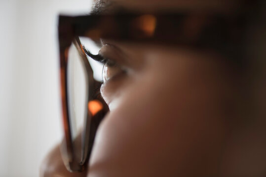 Close up of young woman in nerdy glasses