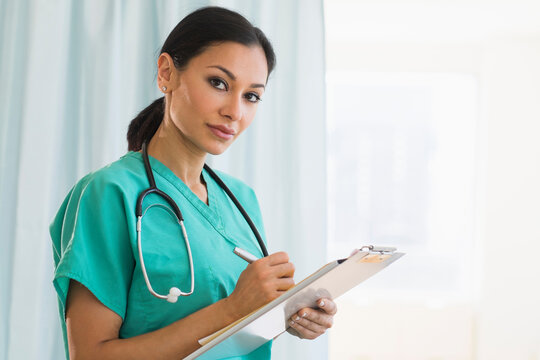 Female doctor making notes