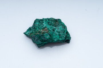 Malachite green ore on a white background. Natural green malachite