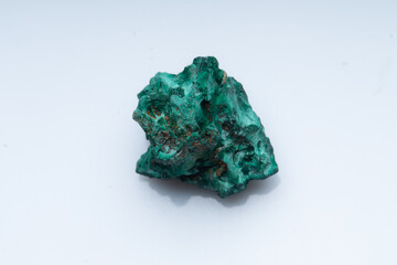 Malachite green ore on a white background. Natural green malachite