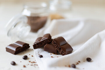 Chocolate, coffee beans on a light background