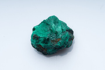 Malachite green ore on a white background. Natural green malachite