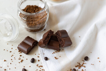 Chocolate; coffee beans on a light background. Top view.