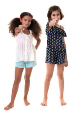 Two small girls pointing at the camera