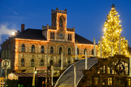 Illuminated Christmas tree and town hall