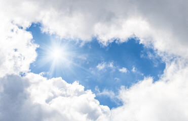 blue sky with white clouds and sun light. Nature background of sky	