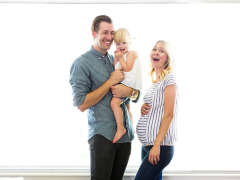 Family portrait of parents with daughter (2-3)