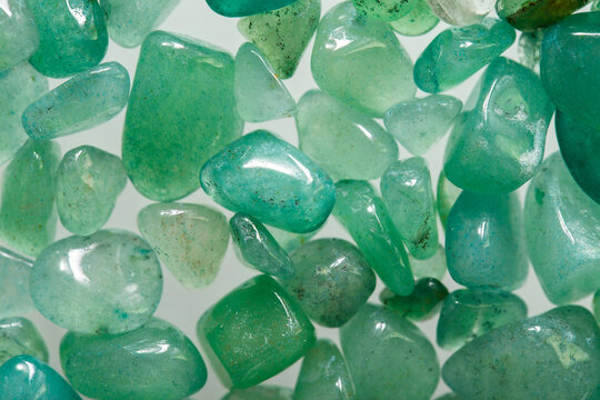Macrophotography of natural quartz stone. Ornamental stones aventurine close-up. Green pebble texture