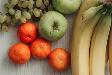 Composition with Summer Colorful Fresh Fruits on Wooden White Background