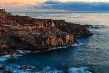 Scenic rocky coastline scenery on sunset