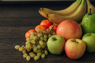 Composition with Summer Colorful Fresh Fruits on Wooden Brown Background