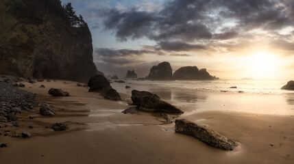 Ecola State Park, Cannon Beach, Oregon, United States. Beautiful Panoramic View of the Sandy and Rocky Beach on Pacific Ocean Coast. Dramatic Sunset Sky.